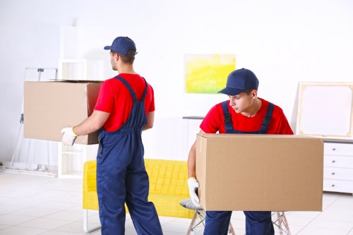 Removal team preparing a local move in Rotherhithe near riverside apartments