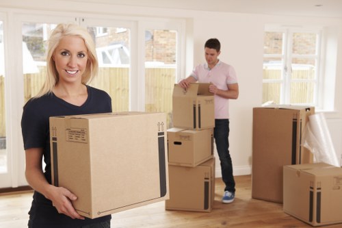 Local house movers loading furniture carefully for a move in Rotherhithe