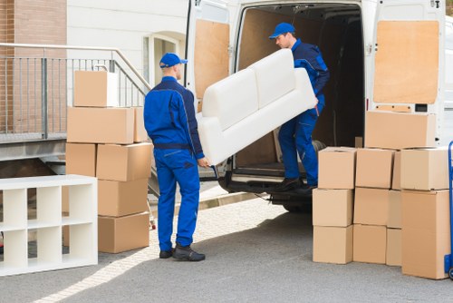 Packed boxes and furniture ready for flat removals in a London apartment building