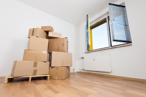 Removal van ready for a local move in Rotherhithe with packed boxes