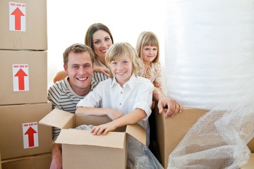 Removalists preparing household items for transport in a Rotherhithe property