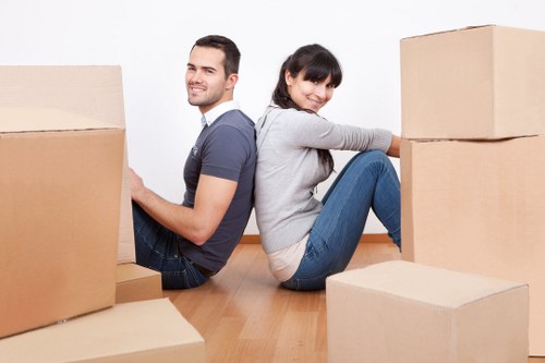 Furniture and boxes being loaded into a removal van