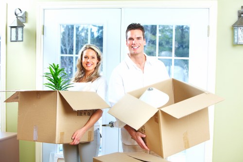Packed boxes labelled for rooms during a move in Rotherhithe