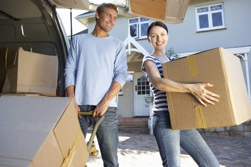 Moving van and movers managing access for a flat relocation in South East London