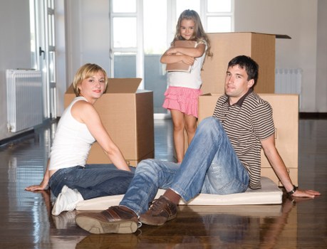 Unpacking boxes and arranging belongings in a new Rotherhithe property